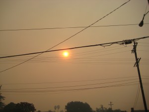 Smoke fills the sky Sunday morning. Here comes the sun.