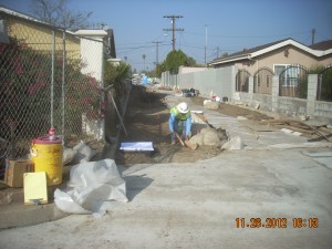 Refining grade elevations for the bio-swale.